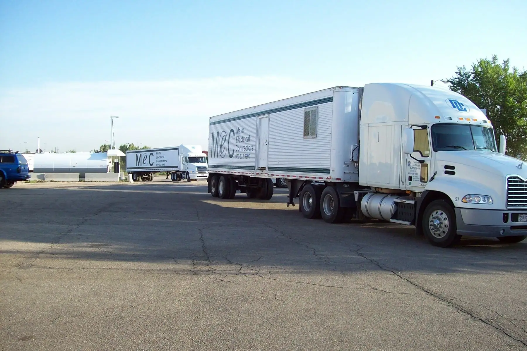 Two white trailer trucks