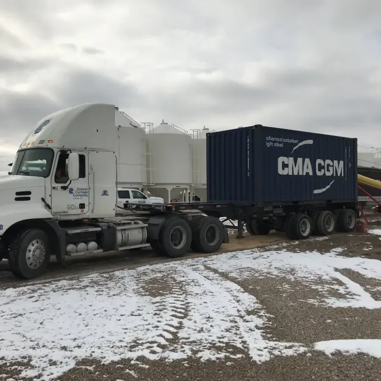 Flatbed truck with a CMA CGM container